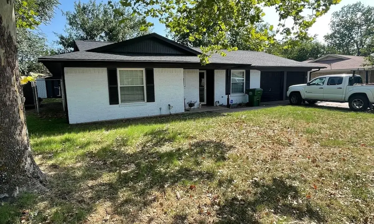 Professional roofing crew working on a residential roof in West Hempfield